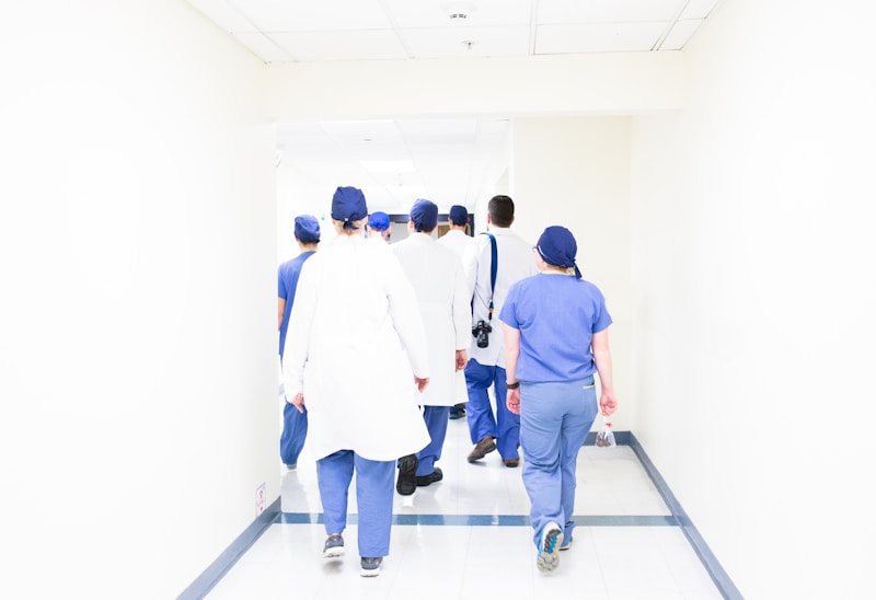 Healthcare professionals in a hospital corridor