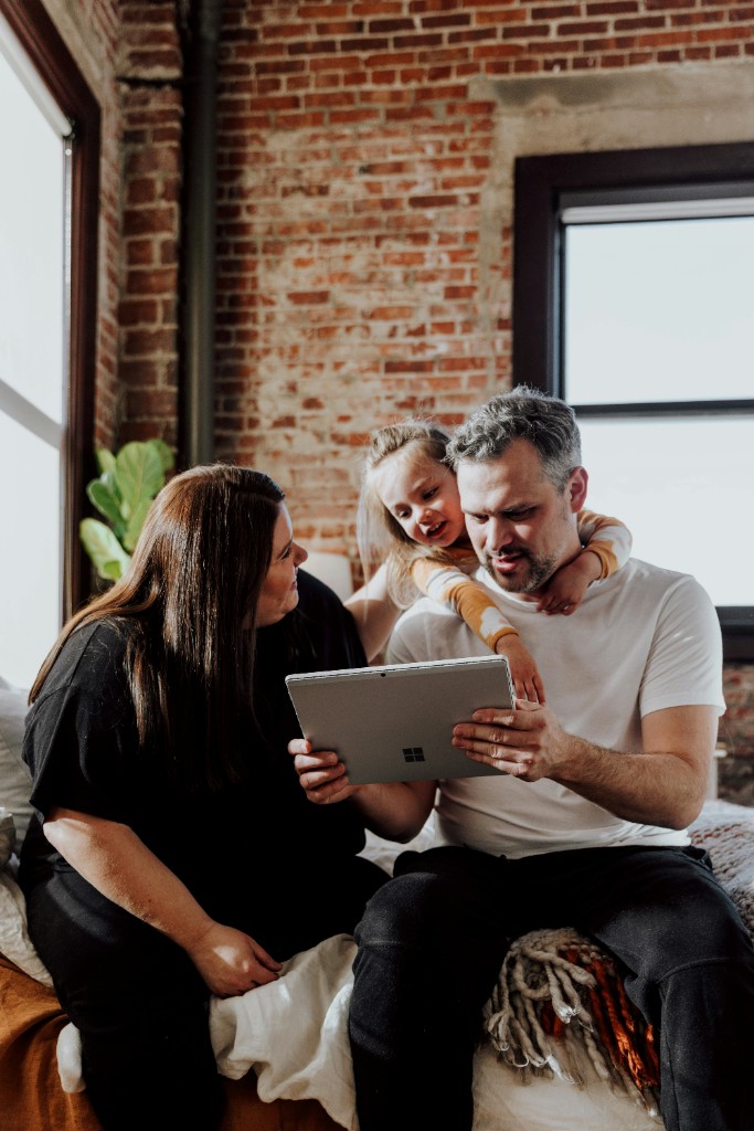 A family looking at patient-safety information together on a tablet